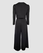 Black 2-piece set with square neck jumpsuit, crop cardigan, fitted waist, and wide-leg pants.
