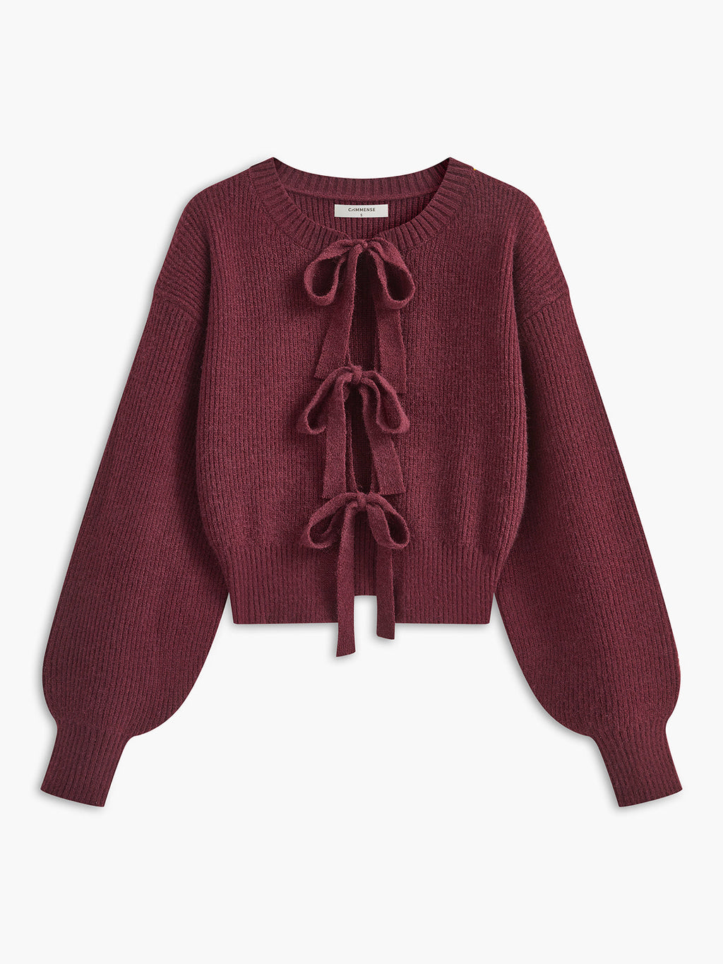 A maroon cropped knit cardigan with lace trim, ribbed texture, three bows, and balloon sleeves.