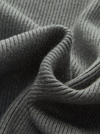 Classic Knitted Cardigan in dark gray ribbed fabric, vertical lines, cozy buttoned layering.